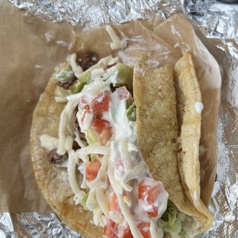 Tacon Madre - Beef taco with lettuce, cheese, tomatoes & sour cream all on a bed of a freshly made corn tortilla - Tacos Near Me - Grand Rapids, Michigan