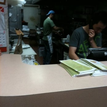 China Wok - a man working in a restaurant kitchen - Chinese Near Me - Bronx, New York