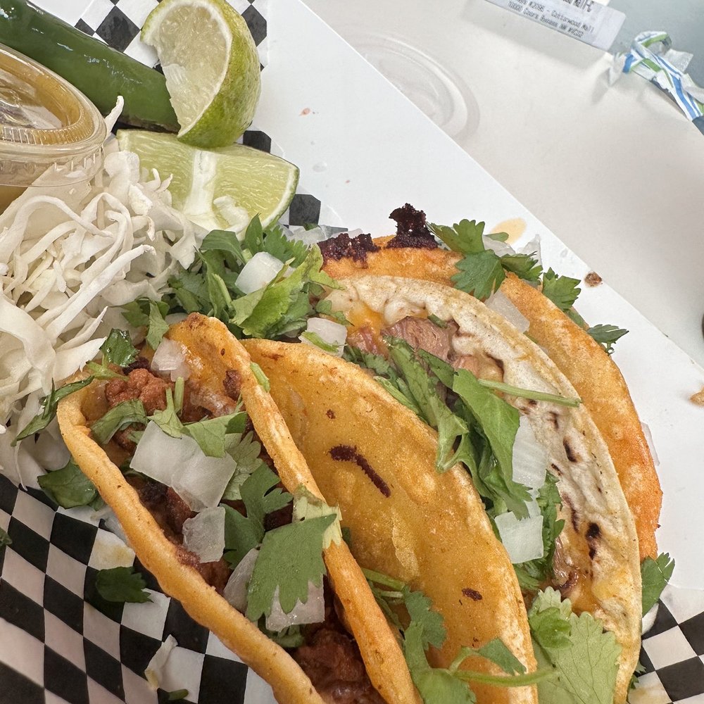 two tacos on a checkered plate two tacos on a checkered plate