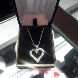 10k yellow gold diamond heart pendant with 25.5" 10k yellow gold chain.