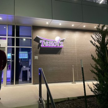 T-Shotz - a man walking out of a store - Golf Near Me - Kansas City, Missouri