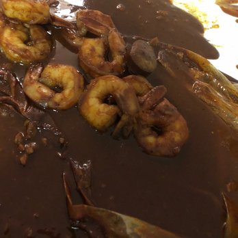 Pirates Kitchen - Dark red enchilada sauce aka Cajun sauce! With shrimp and a piece of hotdog ! - Cajun/Creole Near Me - Artesia, California