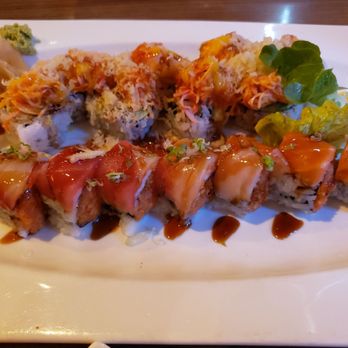 Fancy Sushi - Top: Volcano roll Bottom: Christmas roll - our favorite! - Japanese Near Me - Clermont, Florida Fancy Sushi - Top: Volcano roll Bottom: Christmas roll - our favorite! - Japanese Near Me - Clermont, Florida