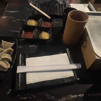 Khan Skewer Restaurant - Table set up. Complimentary Chinese New Year dumpling - Barbeque Near Me - Honolulu, Hawaii
