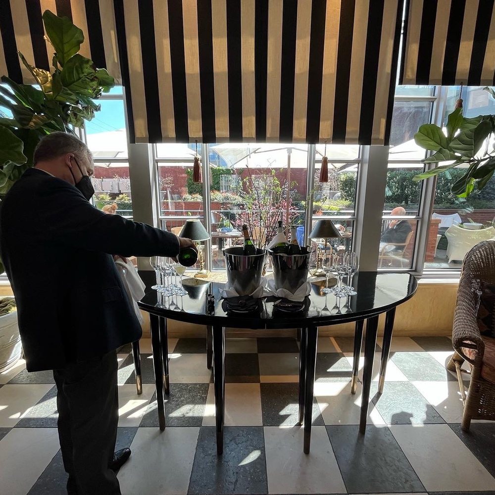 The Ivy Hotel - James pouring some champagne for us upon arrival - Hotels Near Me - Baltimore, Maryland The Ivy Hotel - James pouring some champagne for us upon arrival - Hotels Near Me - Baltimore, Maryland