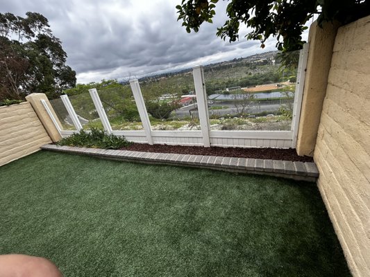 Artificial Turf and New planter - This property wanted new turf and planter that was ground level.