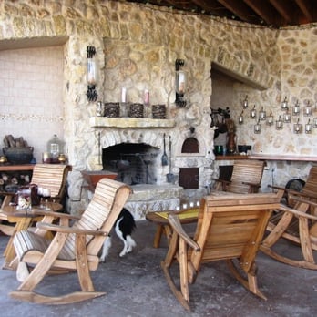 Red Caboose Winery and Vineyards - seating area with fireplace - Wineries Near Me - Meridian, Texas Red Caboose Winery and Vineyards - seating area with fireplace - Wineries Near Me - Meridian, Texas