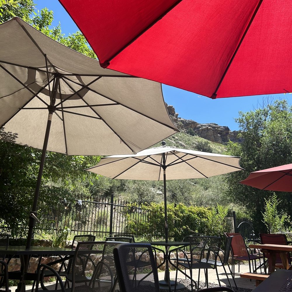 Red Rocks Beer Garden - tables and umbrellas - Beer Gardens Near Me - Morrison, Colorado Red Rocks Beer Garden - tables and umbrellas - Beer Gardens Near Me - Morrison, Colorado