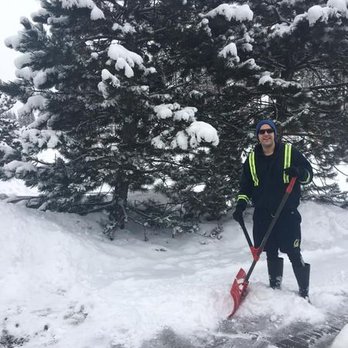 Nathan's Yard Care - a man shoveling snow - Lawn Services Near Me