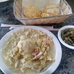 Chicken noodle dinner with green beans and biscuits.