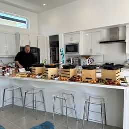 Buffet of bagels and lox, waffles, sausage, bacon, breakfast potatoes and fresh fruit. Buffet of bagels and lox, waffles, sausage, bacon, breakfast potatoes and fresh fruit.