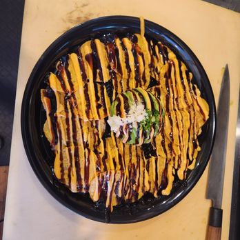 Slice n Spice - a plate of nachos on a cutting board - Pizza Near Me - Airmont, New York Slice n Spice - a plate of nachos on a cutting board - Pizza Near Me - Airmont, New York