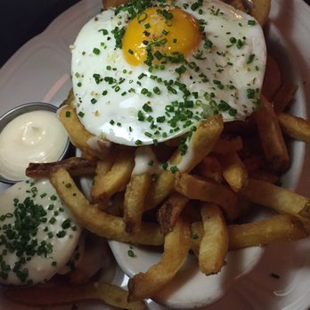 Au Cheval - Fries with fried egg and garlic aioli - Bars Near Me - Chicago, Illinois Au Cheval - Fries with fried egg and garlic aioli - Bars Near Me - Chicago, Illinois