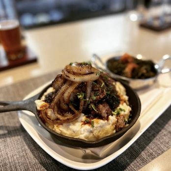Showroom - Adobo braised short rib with caramelized onions, mashed potatoes and collard greens. - New American Near Me - Frederick, Maryland