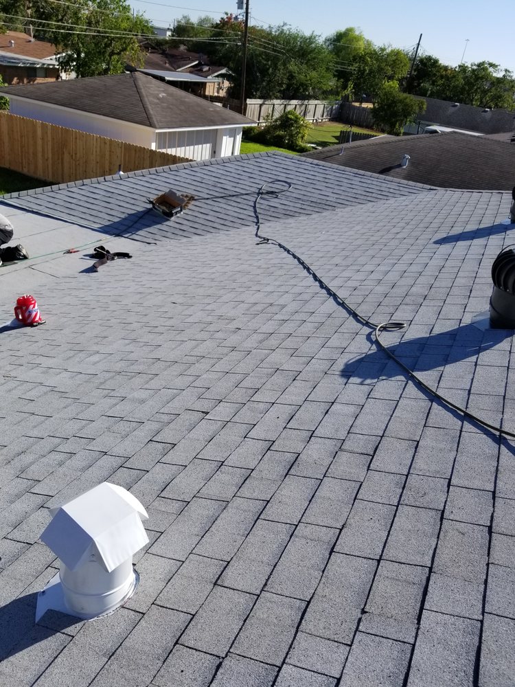 Slide of Vela's Roofing and Construction