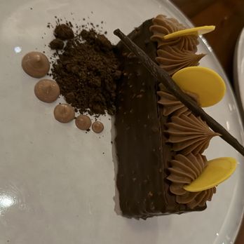The Simon At Reston Station - Chocolate and hazelnut cake with tasty chocolate buttons etc - New American Near Me - Reston, Virginia The Simon At Reston Station - Chocolate and hazelnut cake with tasty chocolate buttons etc - New American Near Me - Reston, Virginia