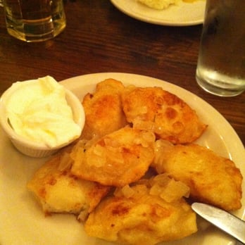 Karczma - Potato and cheese (Russian) pierogis, fried with a side of sour cream. - Polish Near Me - Brooklyn, New York