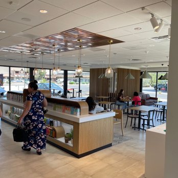 The Coffee Bean & Tea Leaf - people walking through a coffee shop - Coffee Roasteries Near Me - Scottsdale, Arizona