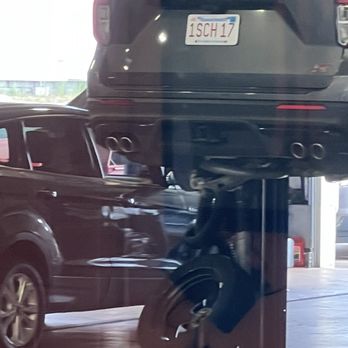 Quirk Ford - Explorer on lift at Quirk - Car Dealers Near Me - Quincy, Massachusetts
