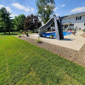 JC Stone Landscaping - a backyard with a pool and a slide - Landscaping Near Me JC Stone Landscaping - a backyard with a pool and a slide - Landscaping Near Me