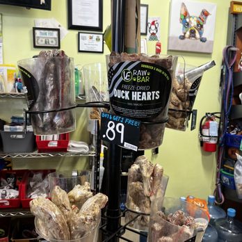 Simply Diego's - Bags of freeze-dried duck hearts and necks for dogs are arranged on a display rack in a pet store, with a price of 89 cents each. - Pet Stores Near Me - Albuquerque, New Mexico