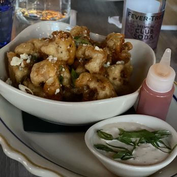 The Whale Chicago - Buffalo cauliflower appetizer. Look at that cute little bottle the buffalo sauce came in! - New American Near Me - Chicago, Illinois