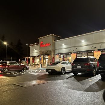 Chick-fil-A - ows cars parked in a parking lot - Chicken Shop Near Me - Kirkland, Washington