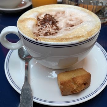 Le Grand Café des Capucines - Cappuccino with a mini Madeleine! - French Near Me - Paris, 75