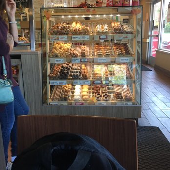Tim Hortons - a woman standing in front of a bakery - Donuts Near Me - Erie, Pennsylvania Tim Hortons - a woman standing in front of a bakery - Donuts Near Me - Erie, Pennsylvania