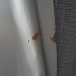 Dried blood on the curtains. Dried blood on the curtains.