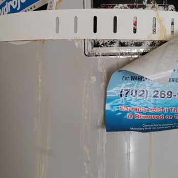 Las Vegas Home Inspections - 2009 water heater-- obvious old damage - Home Inspectors Near Me - Henderson, Nevada Las Vegas Home Inspections - 2009 water heater-- obvious old damage - Home Inspectors Near Me - Henderson, Nevada