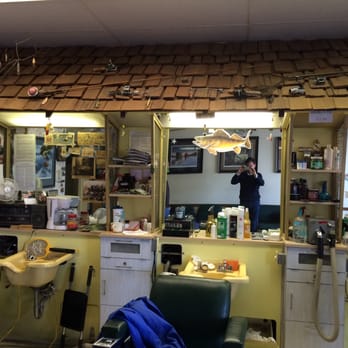 Grover Street Barber Shop - The hunting and fishing theme continues above the mirrors and cabinets - Barbers Near Me - Omaha, Nebraska Grover Street Barber Shop - The hunting and fishing theme continues above the mirrors and cabinets - Barbers Near Me - Omaha, Nebraska