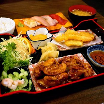 Maneki - Variety Ozen: meal arranged in a bento box. Sushi, tempura and chicken-kuwayaki. Includes sunomono, rice, miso soup, fruit ($28). - Japanese Near Me - Seattle, Washington Maneki - Variety Ozen: meal arranged in a bento box. Sushi, tempura and chicken-kuwayaki. Includes sunomono, rice, miso soup, fruit ($28). - Japanese Near Me - Seattle, Washington