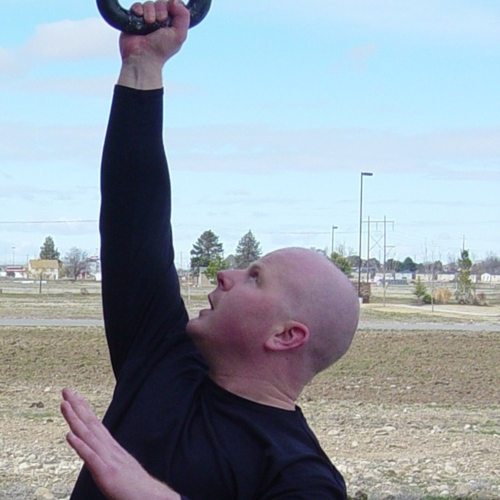 Idaho Kettlebells - Owner Jim Beaumont demonstrates Bottom Up Press - Interval Training Gyms Near Me - Eagle, Idaho Idaho Kettlebells - Owner Jim Beaumont demonstrates Bottom Up Press - Interval Training Gyms Near Me - Eagle, Idaho