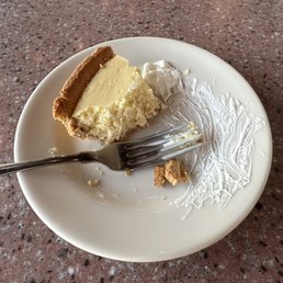 Flat River Grill - Key Lime Pie (halfway through eating) - lime, key lime pie, key, food, sweet pie, dessert, pie - New American Near Me - Lowell, Michigan
