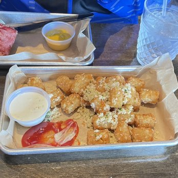 American Grub - Garlic tater tots - yummy - Burgers Near Me - Tustin, California American Grub - Garlic tater tots - yummy - Burgers Near Me - Tustin, California