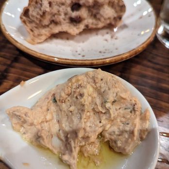 Jimmy P's Charred - They bring two types of bread, this sweet one and a white dinner roll with a flavored butter. - Steakhouses Near Me - Naples, Florida