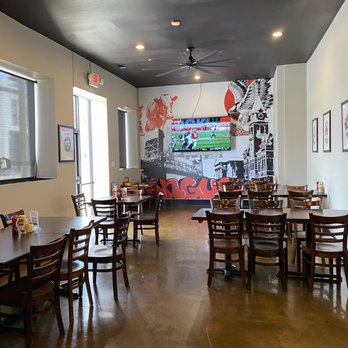 Angus Grill - a dining room with tables and chairs - Burgers Near Me - Wilmington, North Carolina