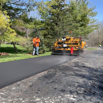 Quality Paving - a man working on a road - General Contractors Near Me - Canton, Michigan