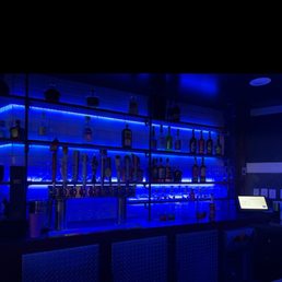 a bar with blue lighting