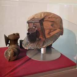 WV Mine Wars Museum - A miner's "helmet" which had a small oil or carbide-burning lamp used for light.
