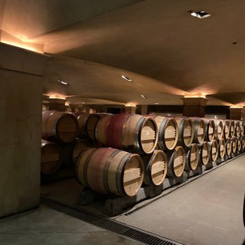 Nickel & Nickel - rows of wine barrels in a cellar - Wineries Near Me - Oakville, California
