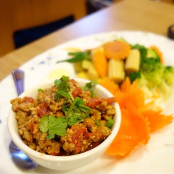 Thai North - a plate of food on a table - Thai Near Me - Brighton, Massachusetts Thai North - a plate of food on a table - Thai Near Me - Brighton, Massachusetts