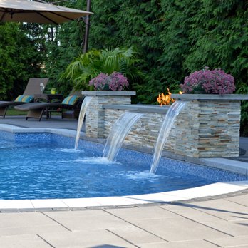Above All Masonry Design - A Hicksville backyard with water and fire features. https://www.aboveallmasonry.com/hicksville-ny-landscape-design-project-relaxing-retreat - Masonry/Concrete Near Me - Bohemia, New York