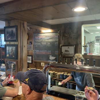 The cooking carberry pizza - Great beers and great brews.  Had 5 different pizzas and they all tasted great! - Pizza Near Me - Munising, Michigan