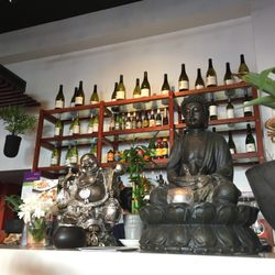 Maenam Lao & Thai - The counter, with two Buddhas watching over us.