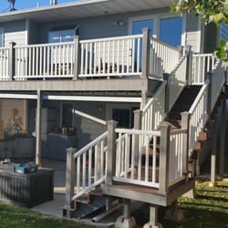 Tiberius Smith Construction - We've added the 2 Landings + Stairs to the Deck and stained all the framework with color match for Railing Posts, Installed D...