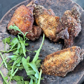 Catch 22 - Wings with reaper garlic pepper dry rub.....will light you on fire! - Gastropubs Near Me - Monroe, Georgia