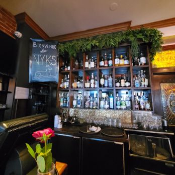 NYK'S - a bar with bottles of liquor - Pubs Near Me - Montreal, Quebec NYK'S - a bar with bottles of liquor - Pubs Near Me - Montreal, Quebec