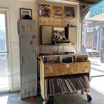 Café Con Leche - a table with records on it - Coffee & Tea Near Me - El Paso, Texas Café Con Leche - a table with records on it - Coffee & Tea Near Me - El Paso, Texas
